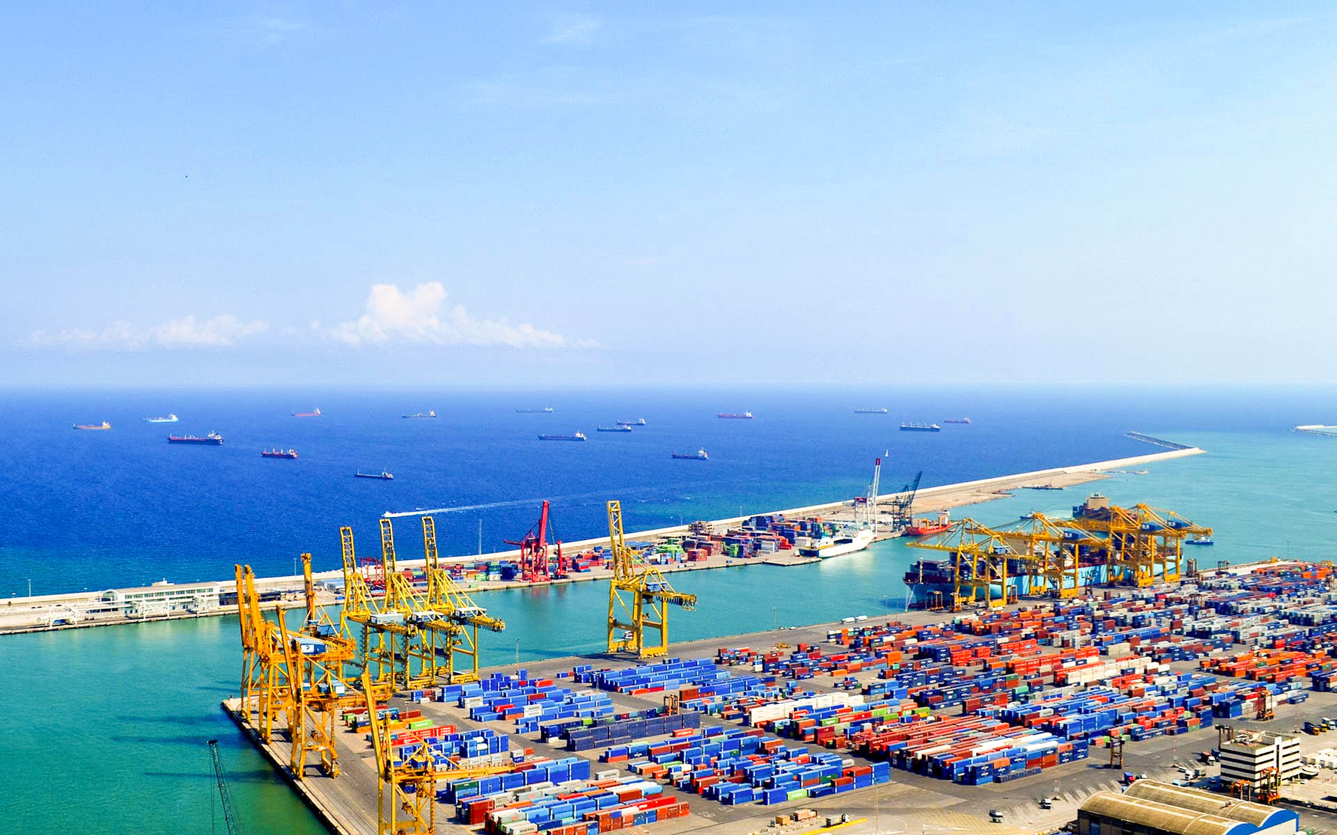 ocean freight year and oceanline freighter port with shipping containers and cranes 
