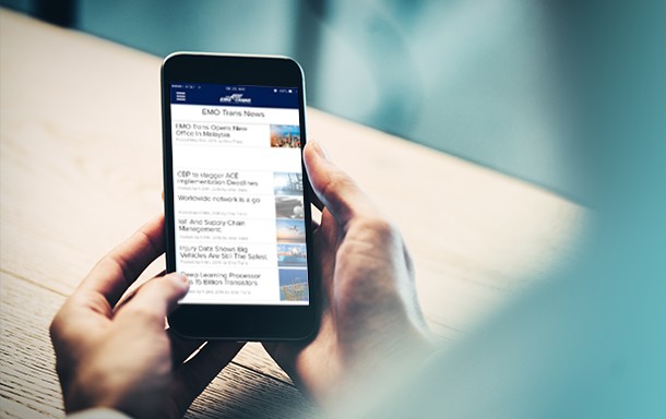 person on mobile device reading emo trans news articles