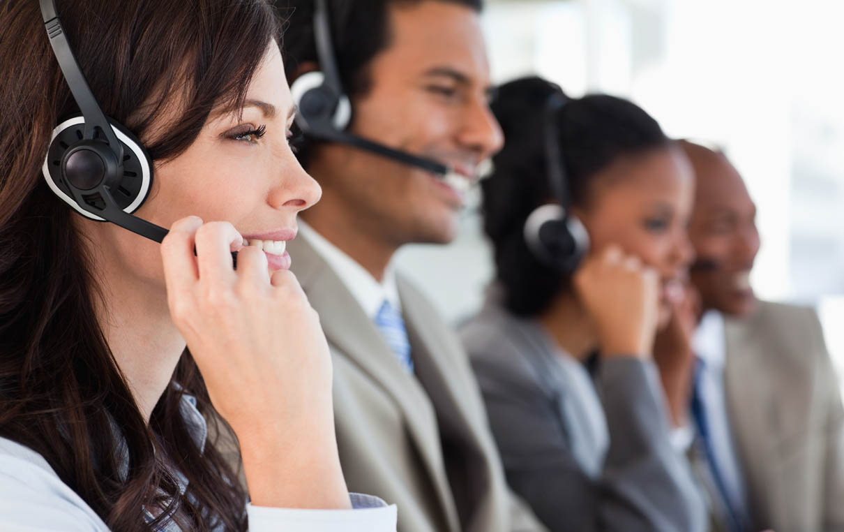 supply chain solutions customer service support team speaking with customers through headsets