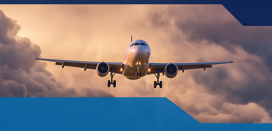 An airplane flying with clouds behind him covering aviation logistics