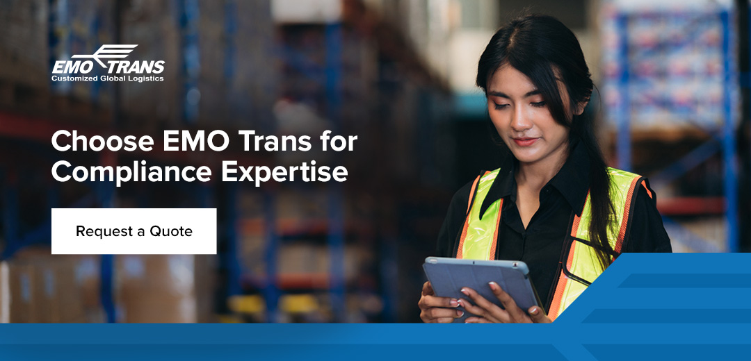 A woman looking at a tablet in a shipping warehouse, encouraging users to choose EMO Trans for compliance expertise. 